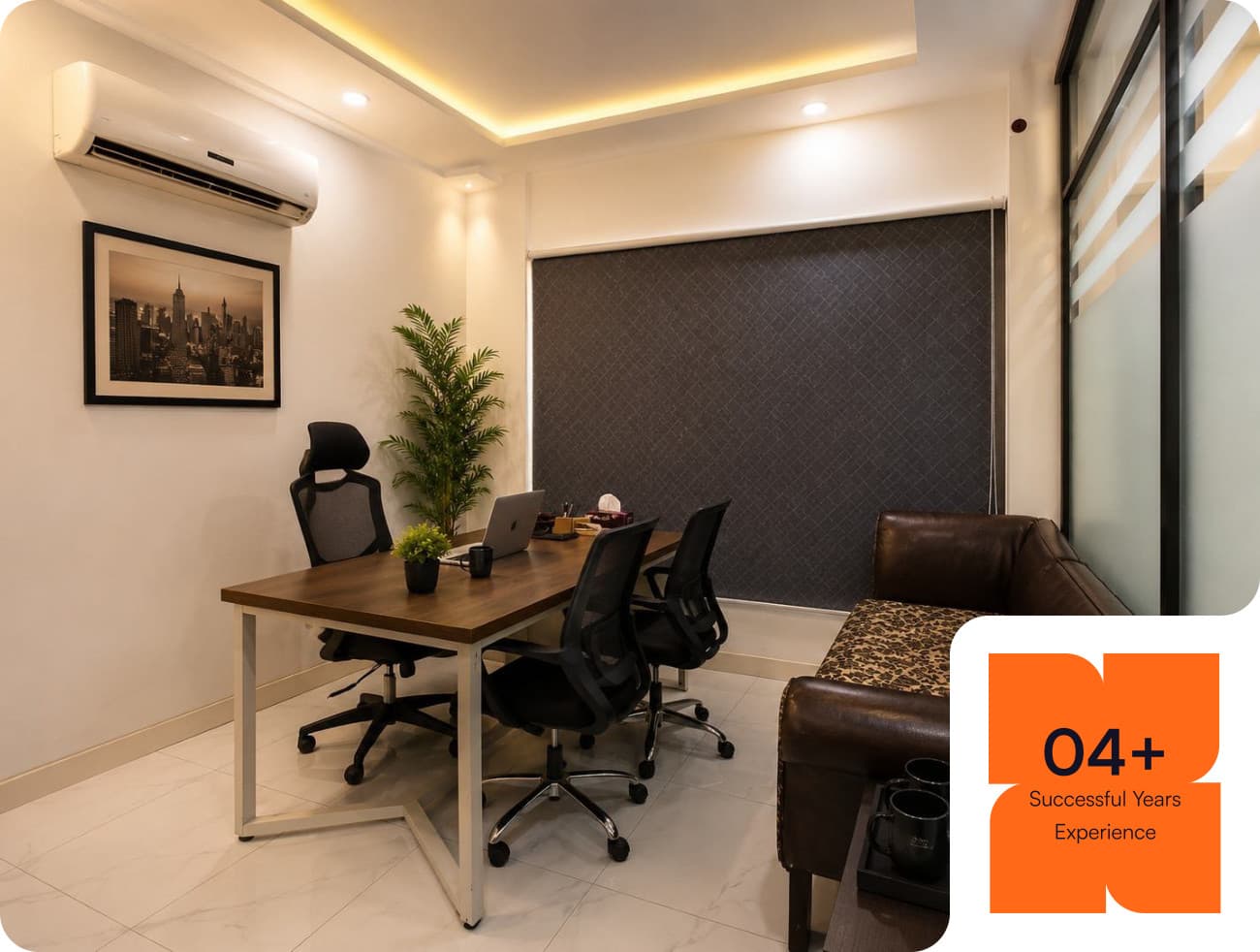 A private office at Co-Remotely with a meeting table, ergonomic chairs and a leather sofa