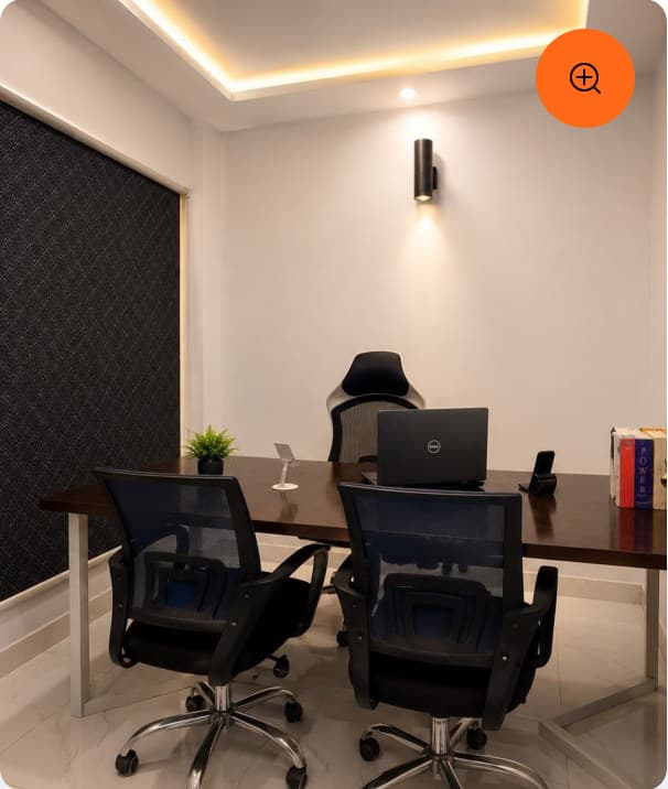 A private office with a desk and acoustic wall panelling